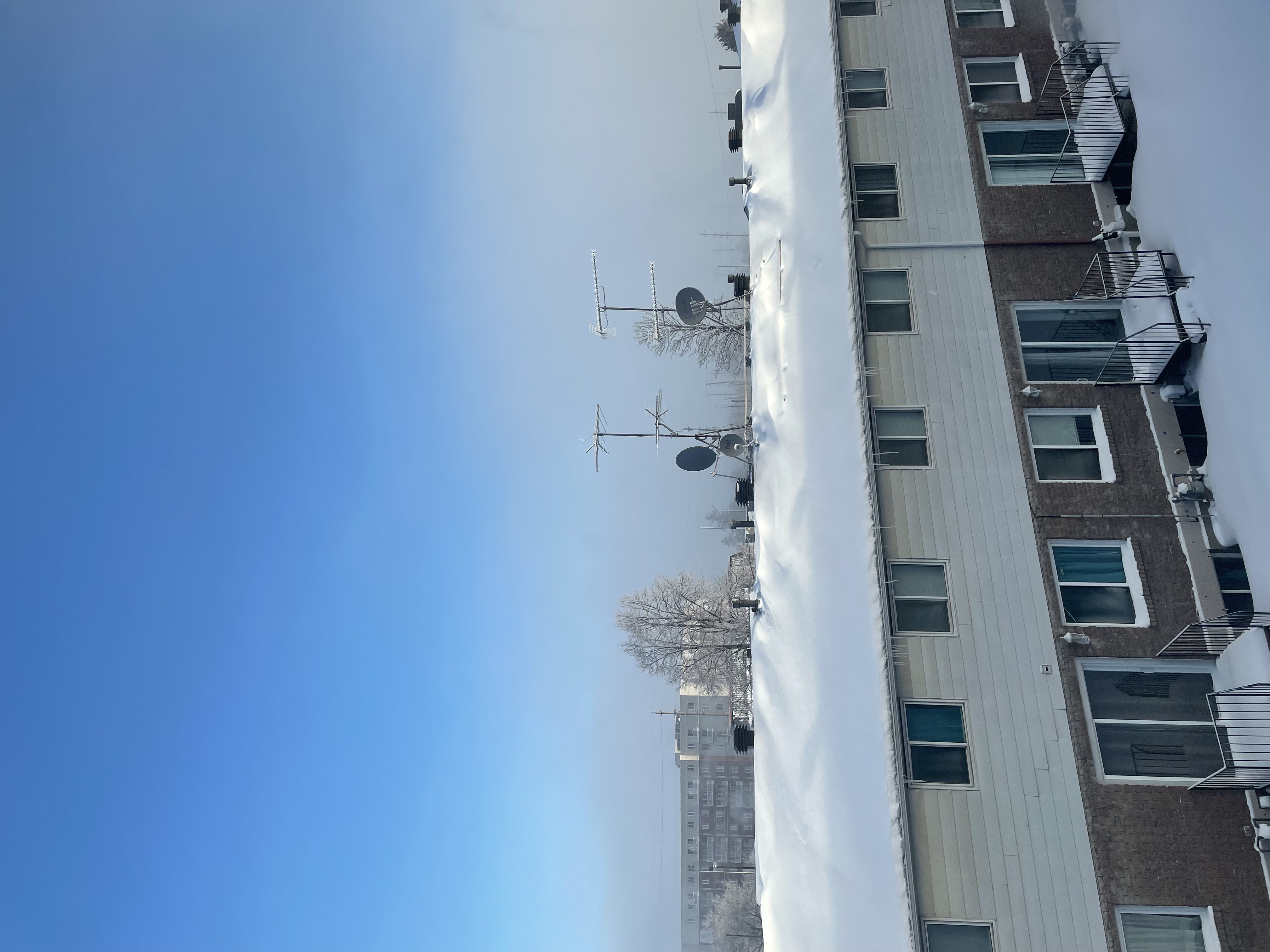 A slanted rooftop covered in winter